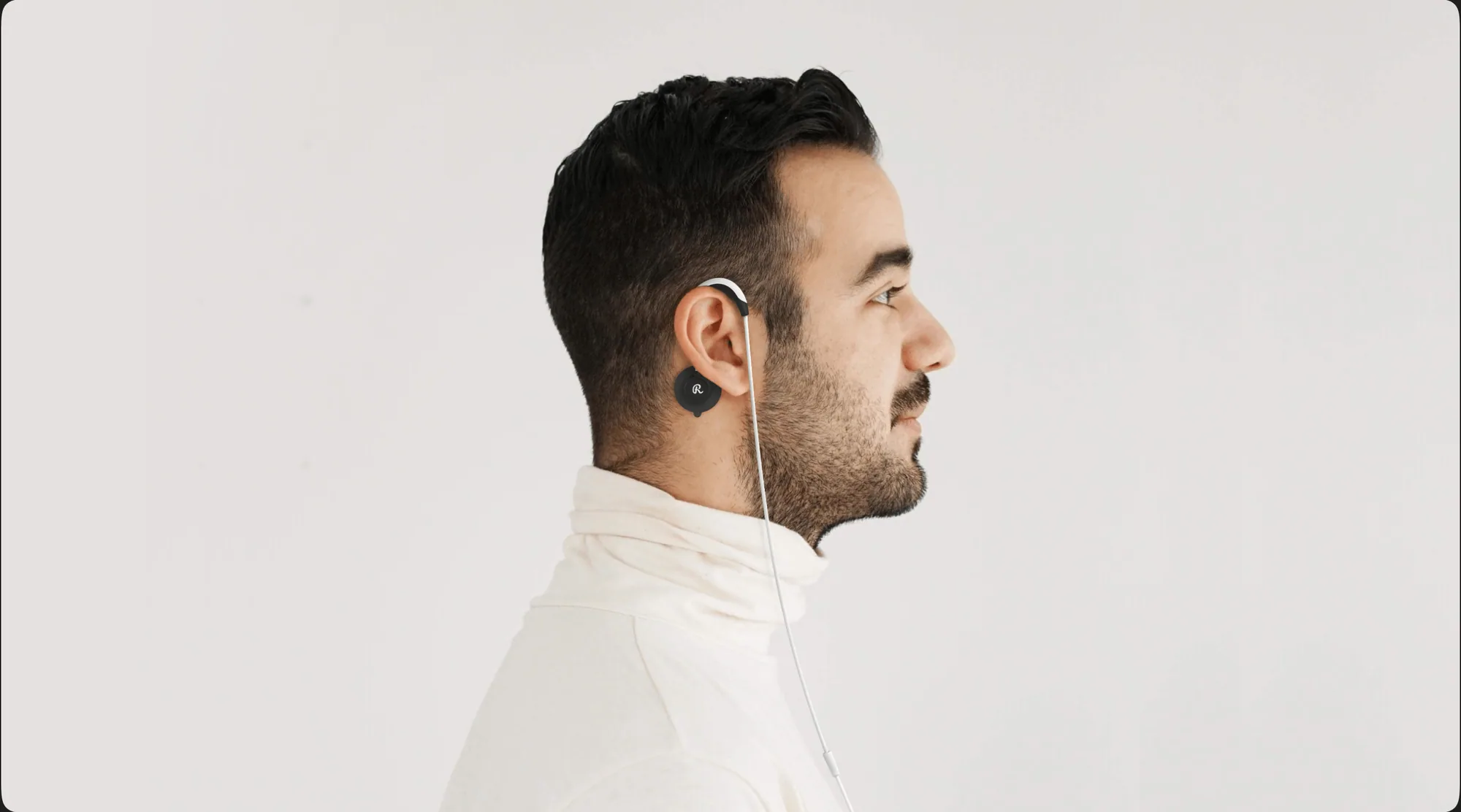 A man wearing the Roga device in a black color.